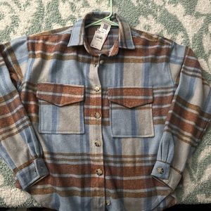 Blue flannel with broncos graphic on back